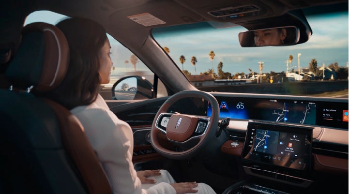 A person is shown driving hands-free on the highway with available Lincoln BlueCruise technology. | All Star Lincoln in Prairieville LA